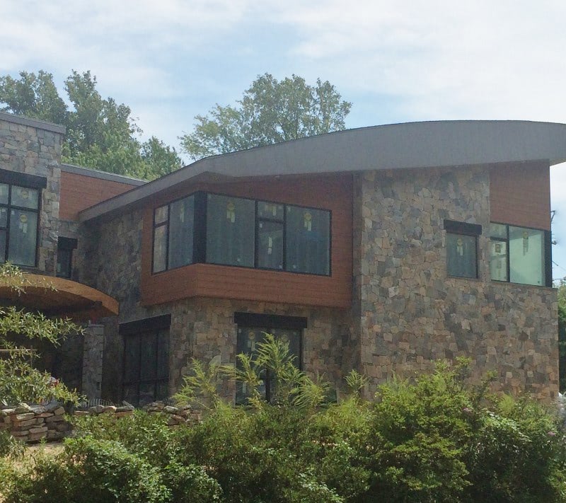 Trespa Pura sidings accents stonework.jpg