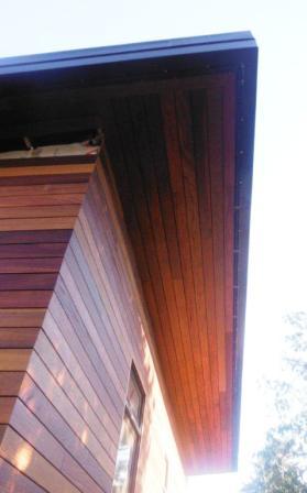 Cumaru hardwood siding and soffits installed in a rainscreen