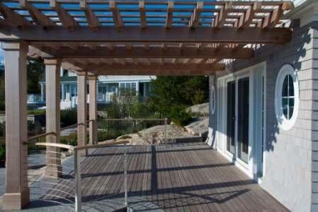 Low maintenance Ipe hardwood decking with pergola and cable rail system