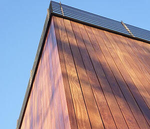 Red Cumaru vertical wood rainscreen siding in Queens