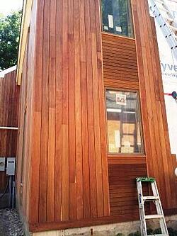 Machiche hardwood vertical rain screen with ipe horizontal siding accent