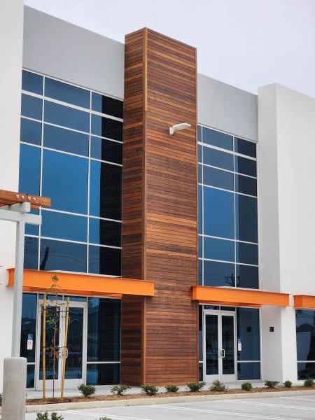 Ipe Wood accents on a commercial building warms the entryway and makes it welcoming