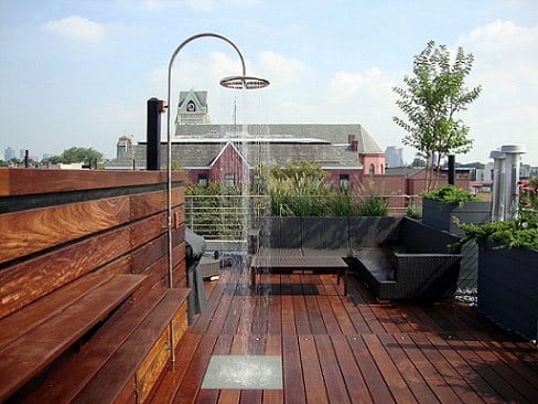 Ipe hardwood rooftop deck with outdoor shower and wood shelves