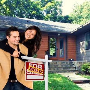 Couple with SOLD sign Trespa