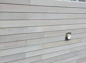 Cumaru wood rainscreen siding with gray tinted finish