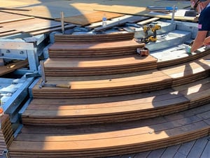 Curved Ipe stairs and architectural millwork installation on rooftop deck in NYC