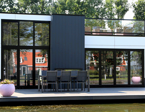 Black siding - Trespa Pura Lumen in Metropolis Black on a garden building with large windows