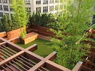 Ipe wood decking, pergola, benches, playground and planters.