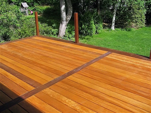 Garapa deck with Ipe borders and trim under construction in a backyard