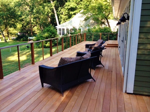 Garapa backyard deck with peaceful views and furniture at Mataverde Decking
