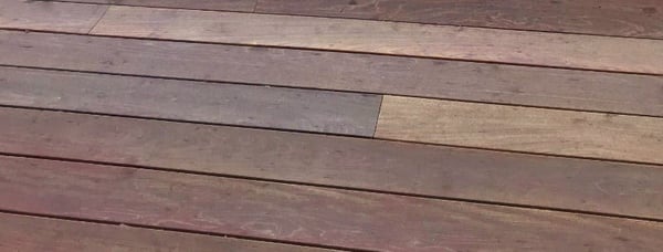 Hardwood decking cupping- moisture below and sunlight above creates imbalance causing wood to move