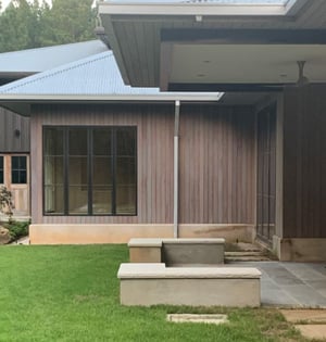 Hardwood rainscreen vertical wood siding and soffits