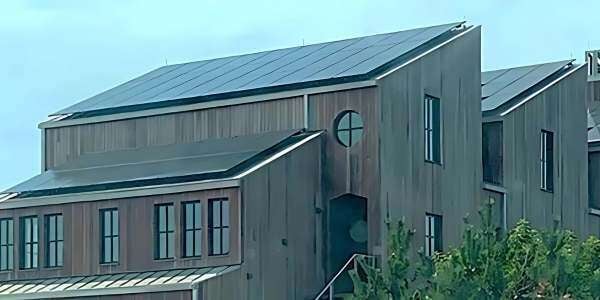 The modern three-peak roofline on this Cape Cod custom home is designed for optimal sunlight capture on the solar panels without sacrificing&nbsp;design.&nbsp;