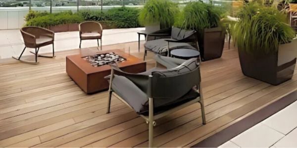 Ipe deck on rooftop with large square, metal fire pit detail
