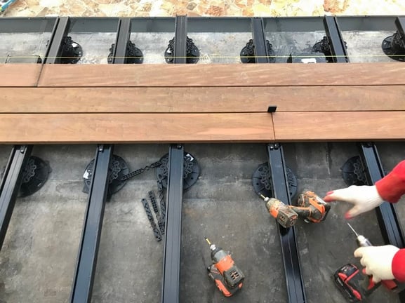 Ipe decking boards are installed using Eurotec Deck Glider hidden fasteners