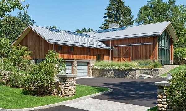 Ipe hardwood rain screen system on modern barn home