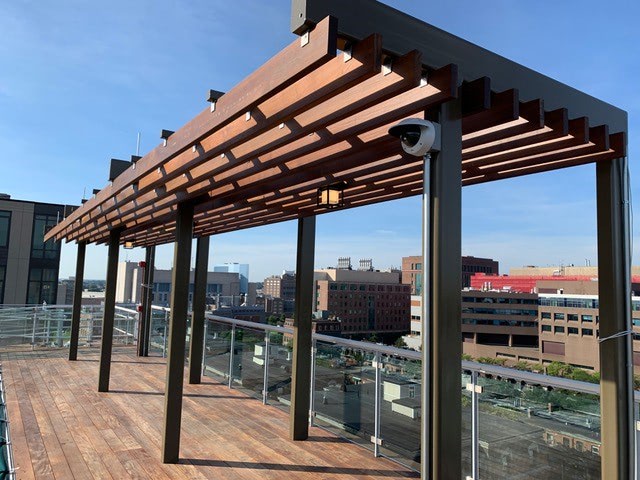Ipe pergola provides shade on Boston rooftop deck