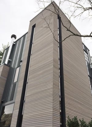 Ipe rainscreen siding installed horizontally softens the vertical height like magic