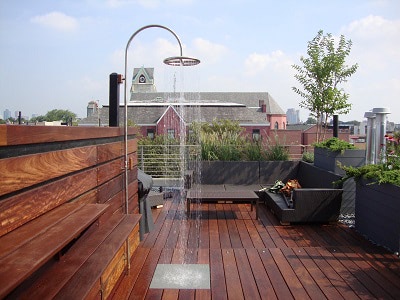 Ipe wood rooftop pool deck with outdoor shower and benches