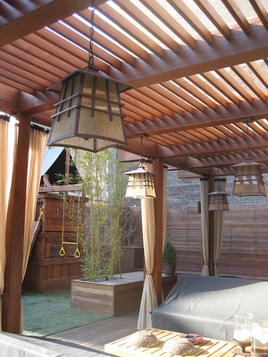 Ipe hardwood decking with pergola and arbor an oasis with curtains lanterns and cushions