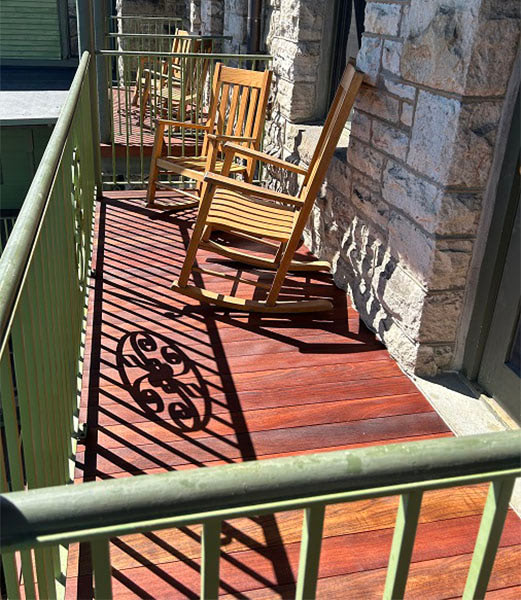Jatoba Brazilian Cherry balcony deck with rocking chair from Mataverde Decking