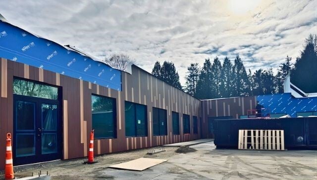 Matunuck Atelier mid-construction installing Pura Tropical Ipe and Western Red Cedar Wood Decors vertically with Climate-Shield CST1 Rainscreen System from MataverdeDecking.com