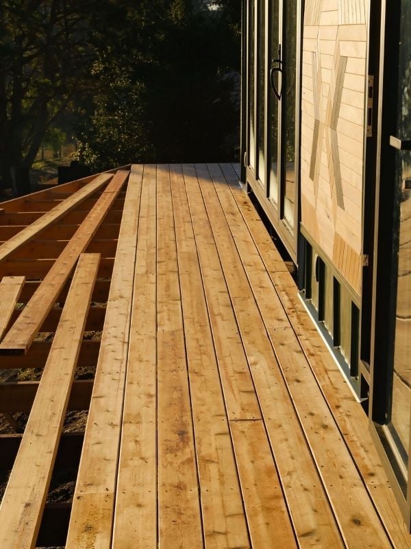 Mataverde SaferWood STK Cedar Decking vertical shot of deck mid-install vertical
