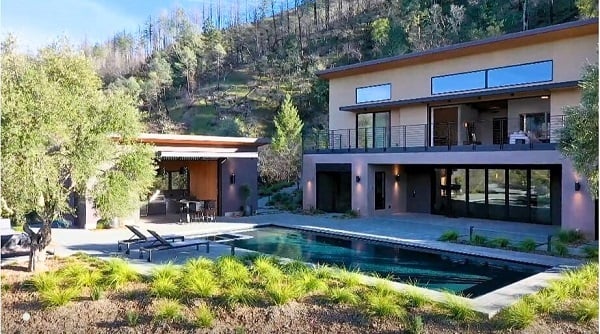 Mataverde SaferWood Vertical Siding and ADU on wildfire rebuild home using ThermaWood FR with stained finish