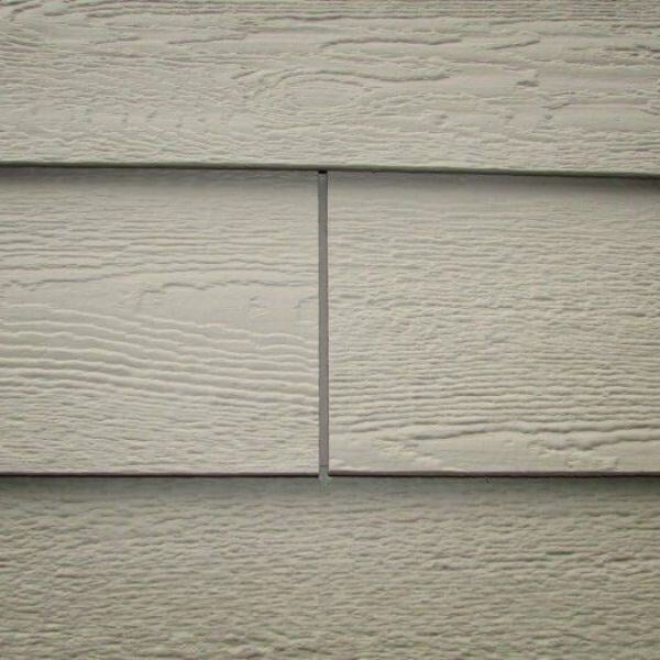 Painted composite siding with gap in planks, courtesy @structuretech.com