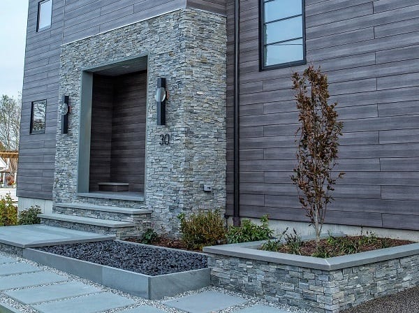 Pura NFC Mystic Cedar siding warms stone entryway and hardscaping
