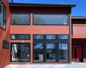 Pura NFC Royal Mahagony Wood Decor on a complete exterior with black trimmed windows