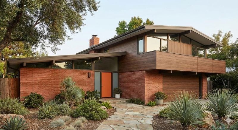 Pura Romantic Walnut wood décor contrasted with red brick on a mid-century house