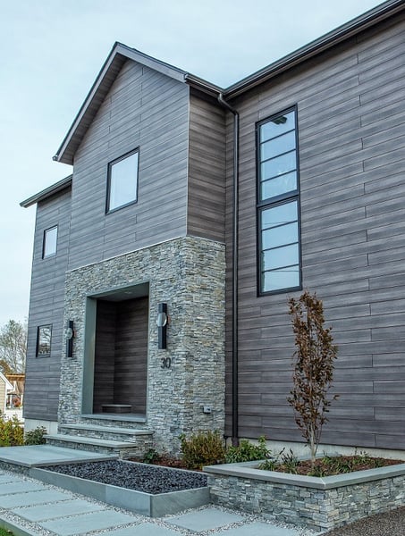 Pura NFC Mystic Cedar Wood Décor mixed with a natural stone entryway and hardscaping 