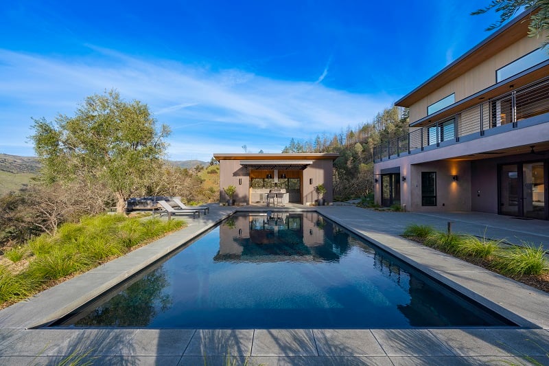 Mataverde SaferWood ThermaWood FR Hem-Fir fire retardant treated wood vertical siding, soffits, and outdoor kitchen ADU, with colored stain