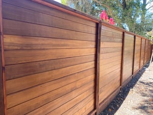 Thermally Modified Hemlock siding used as fencing with Penofin Oil finish from Mataverde Decking and Siding