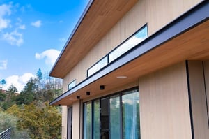 Thermawood FR TG Hemlock siding and soffits 633 reversible with natural cedar stain finish by Mataverde