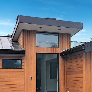 This contemporary home has a wrap of Thermawood Hem-Fir rainscreen siding designed with vertical and horizontal installation to highlight the architecture.