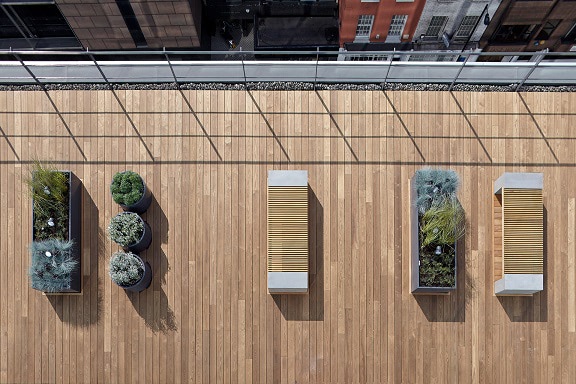 A modern rooftop deck made from thermally modified wood decking material from Mataverde decking.