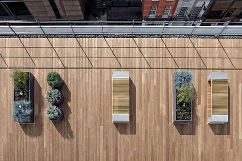 Thermowood natural wood rooftop decking with planters and benches