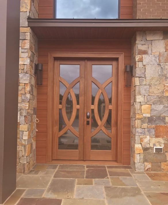 Trespa Pura NFC Sidings with stone and brick.jpg
