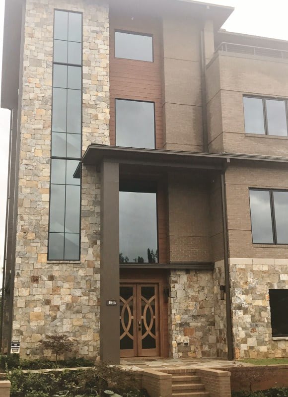 Trespa Pura NFC sidings as accent with stone and brick.jpg