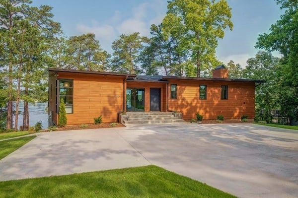 Trespa Pura Romantic Walnut cladding on lakefront home