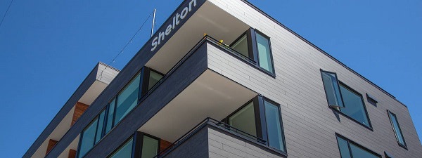 Trespa Pura Slate Ebony on four story apartment building