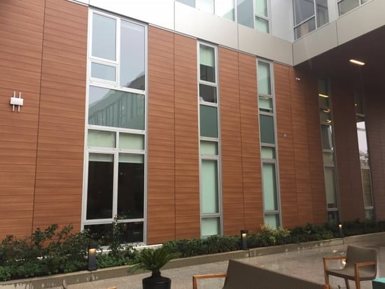 Trespa Pura NFC clads apartment building courtyard in Boston
