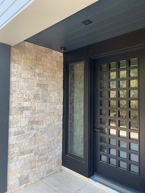Trespa Pura siding Anthracite Gray P25.8.1 on soffits at entryway