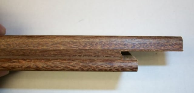 Vertical wood rain screen siding board notched on bottom for Climate-Shield rain screen clip.jpg