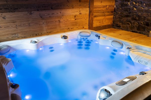 Knotty wood deck and privacy wall around a sunken hot tub