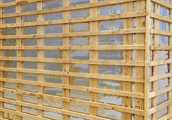 complicated web of furring strips are required for a vertical wood siding layout