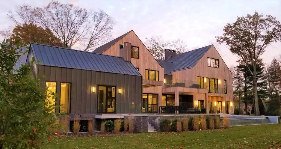 Garapa Hardwood and Climate-Shield Rainscreen wood cladding on lovely residence in New England by Mataverde