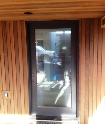Ipe_siding_in_a_vertical_rain_screen_installation_-_detail_at_entry_door_and_soffit-resized-600